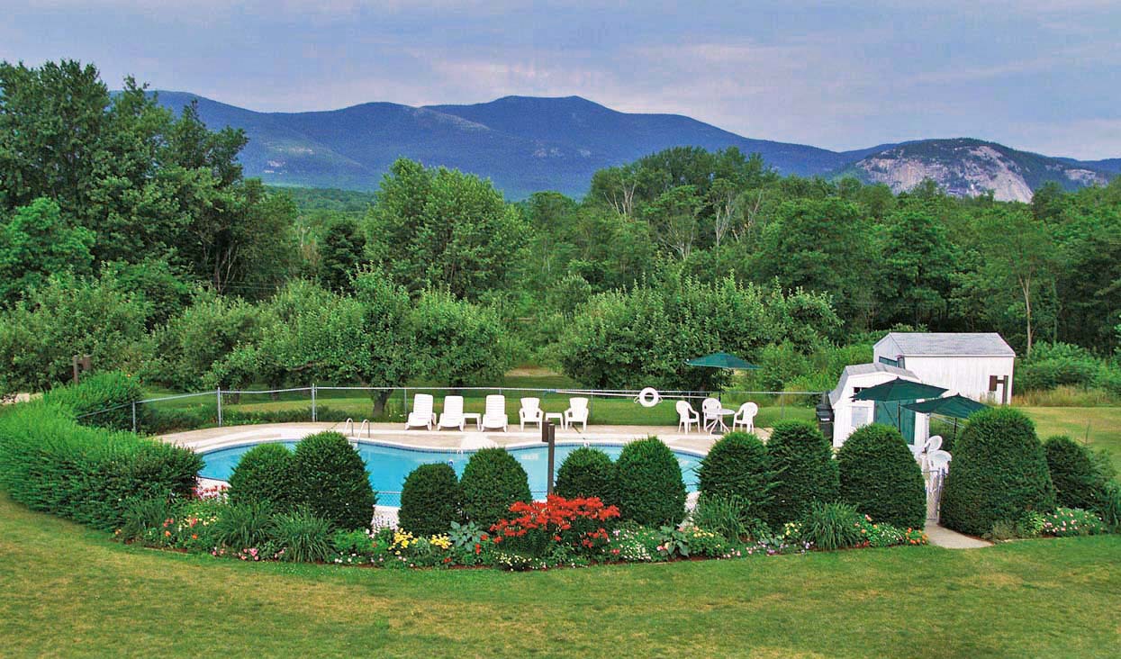 Outdoor heated pool with White Mountains views at Briarcliff Motel